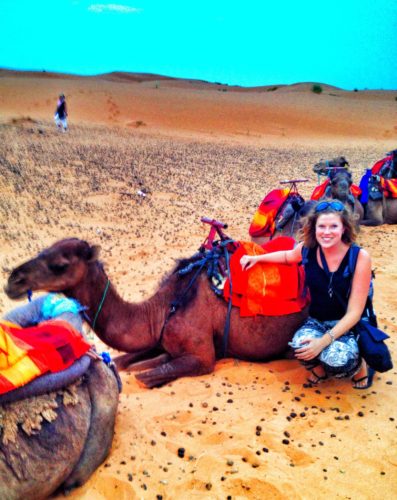 Posing with a camel in the Sahara Desert, Morocco