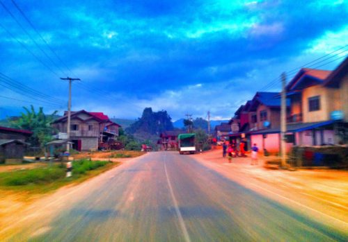 Driving through a town between Luang Prabang to Vang Vieng