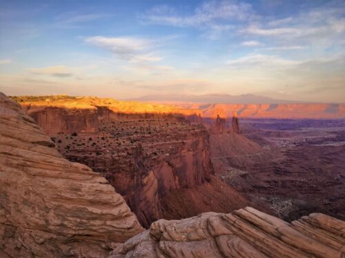 The sun setting over a canyon in Island in the Sky, Utah