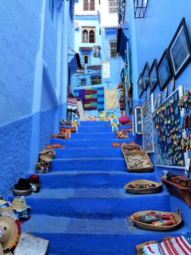 A blue staircase with all kinds of arts and crafts
