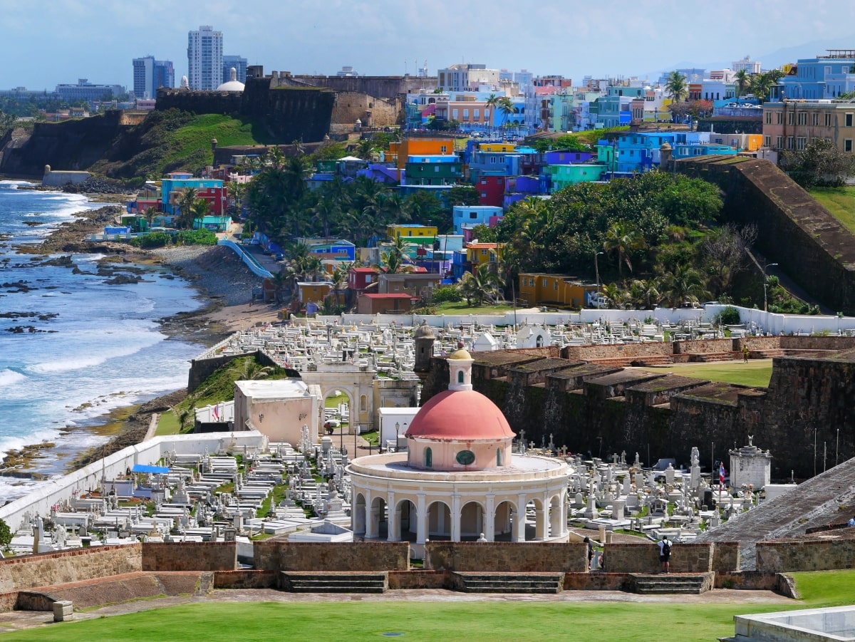 Overlooking the above ground cemeteries and colorful buildings of the La Perla district of San Juan