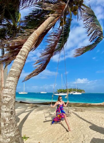 Solo female traveler swinging in Panama