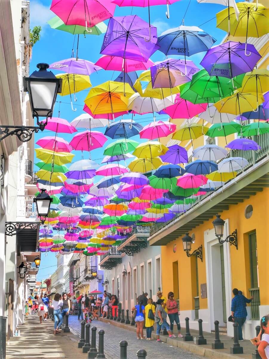 Colorful umbrellas hanging over a pedestrian street in San Juan