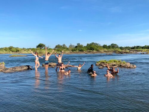 Group of tourists crossing over to Devil's Pool